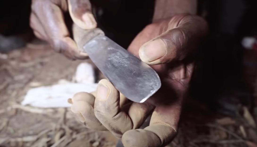 A freshly sharpened traditional circumcision tool awaits a teenage initiate about to have his foreskin removed in the traditional annual ceremony in South Africa