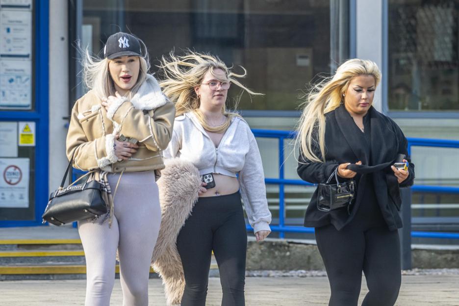 Larisa Sumovskaja (left), Jasmine Orchard (center), and Kera McKeown (right) leaving Poole Magistrates Court.