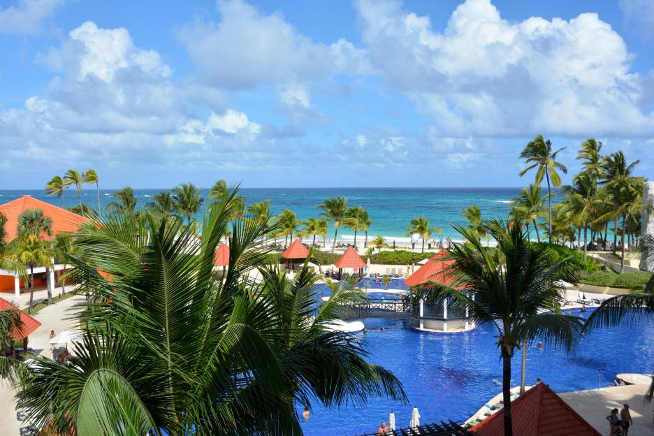 Overview of a hotel with multiple pools and a beach in Punta Cana, Dominican Republic.