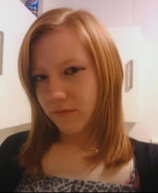 Amanda Martin in her younger years with shoulder-length blonde hair.