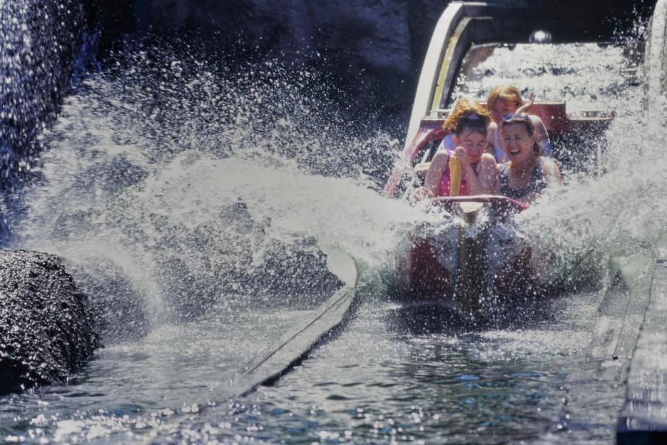People on the River Caves ride at Pleasure Beach Blackpool splashing into the water.