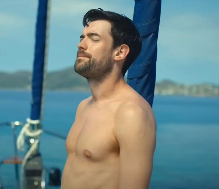 Jack Whitehall topless on a boat.