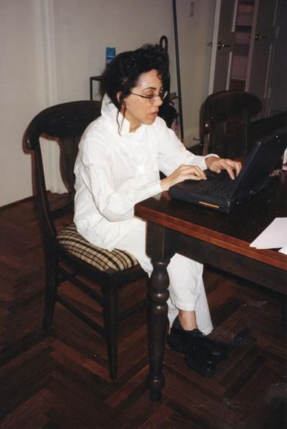Laura Greenberg working at her computer.
