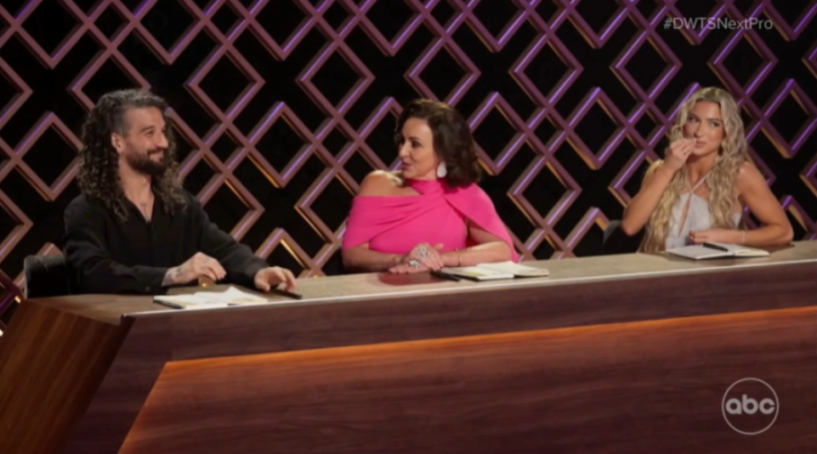 Three judges, two women and one man, seated at a desk.