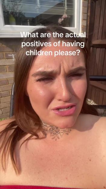 Woman asking "What are the actual positives of having children please?"