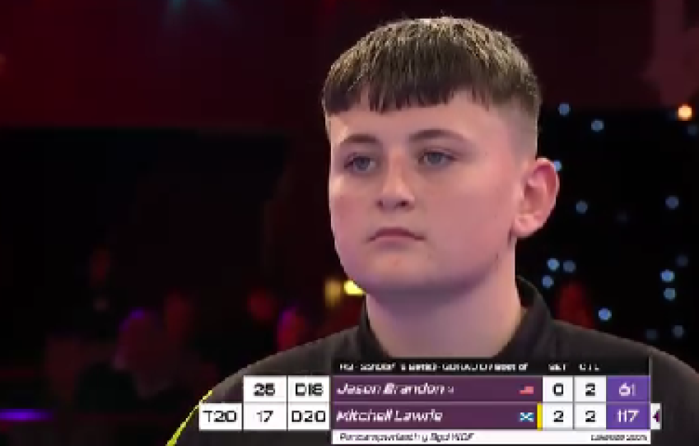 Mitchell Lawrie playing darts.