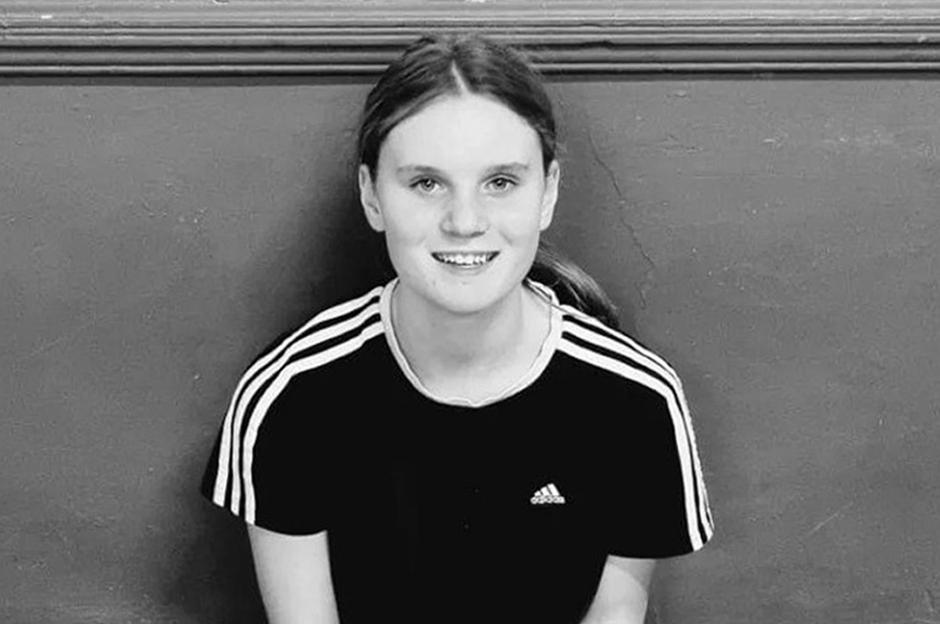 Headshot of Holly Newton, a young woman with a slight smile.