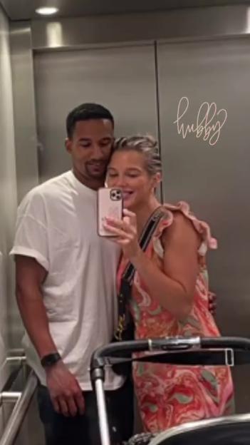 Helen Flanagan taking a selfie with Scott Sinclair, with "hubby" written above them.
