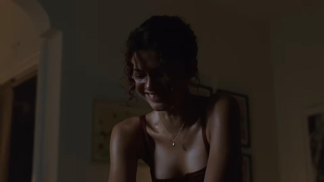 Zendaya as a character in "The Drama" looking down with an anxious expression.