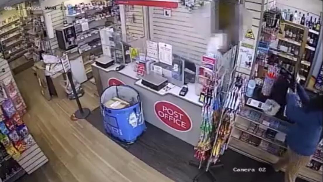 CCTV footage of a person trashing a Post Office counter in a store.
