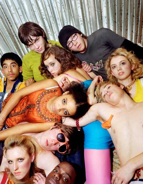 Cast of the TV programme "Skins" piled together in a group shot.