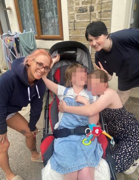 Hannah Hall, her son Finn, and two young children.