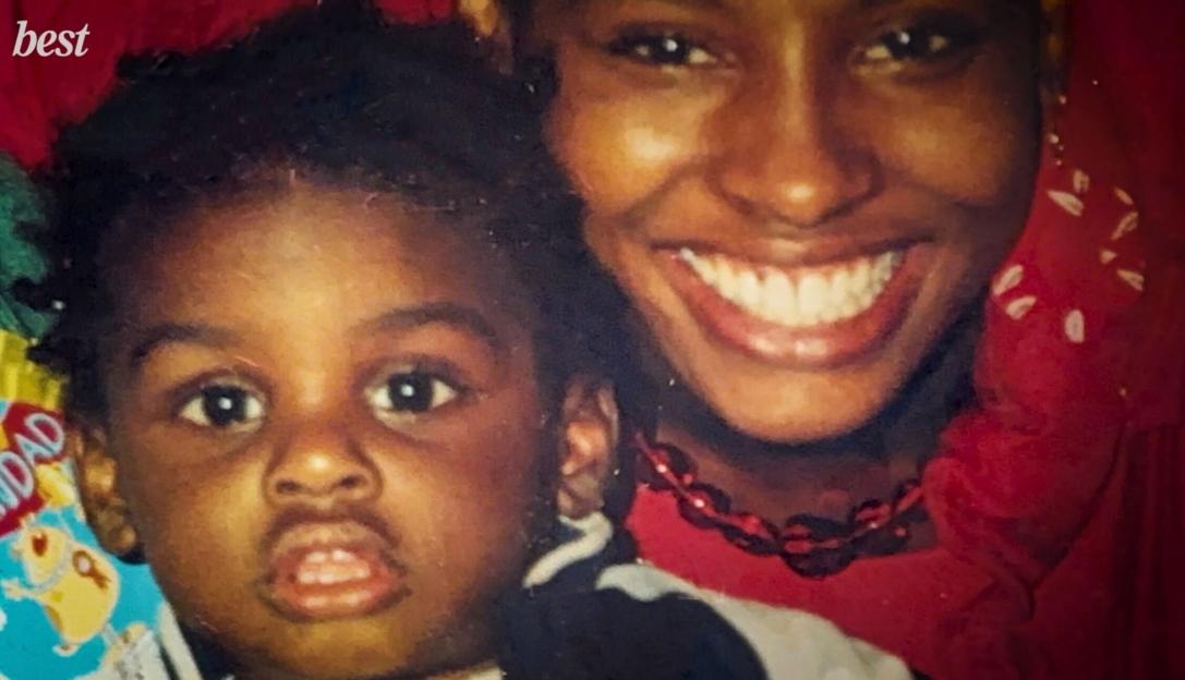 A woman and young child, Sherrell Dillion and her son, smiling at the camera.