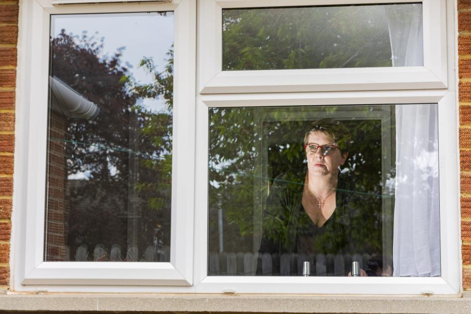 Natalee Gibbings looking out a window.