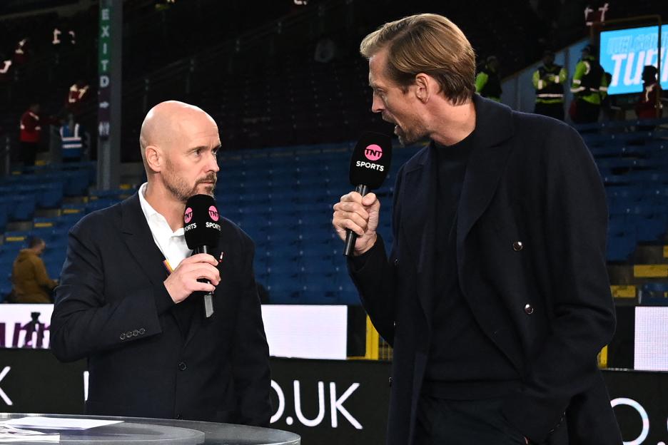 Manchester United manager Erik ten Hag being interviewed by TNT Sports presenter Peter Crouch.