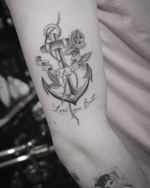Anchor tattoo with a rose and a banner that says "DAD" and "Love you Bust."