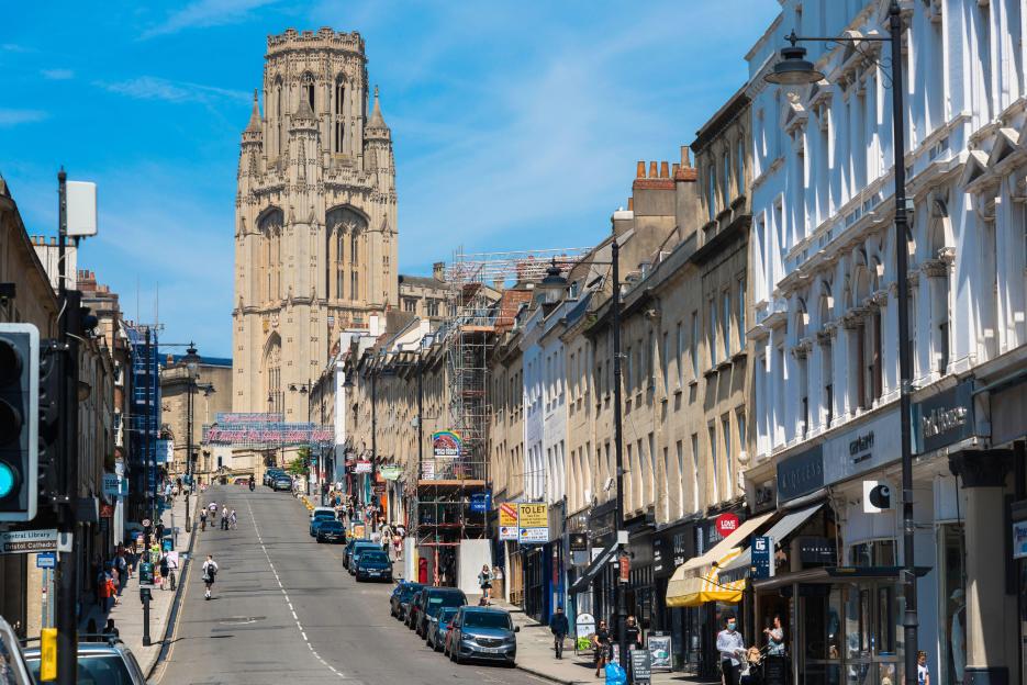 Bristol city centre, view in summer of the sweep of terraced buildings in Park Street leading to the Wills Memorial University building tower, England