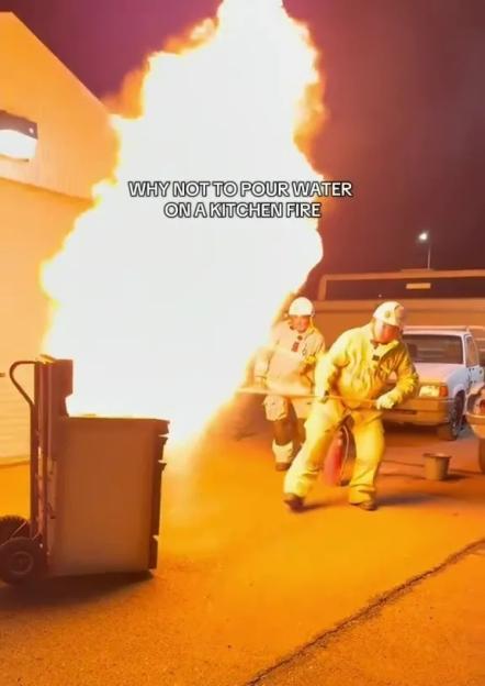 Firefighters demonstrate why water should not be used to extinguish a kitchen fire.