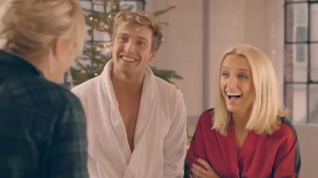 Tiff Watson and Sam Thompson in bathrobes, reacting to a third person off-screen.