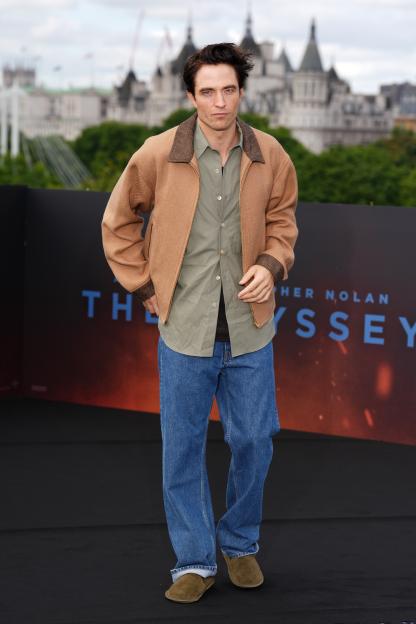 Robert Pattinson poses for photographers at "The Odyssey" film photo call.
