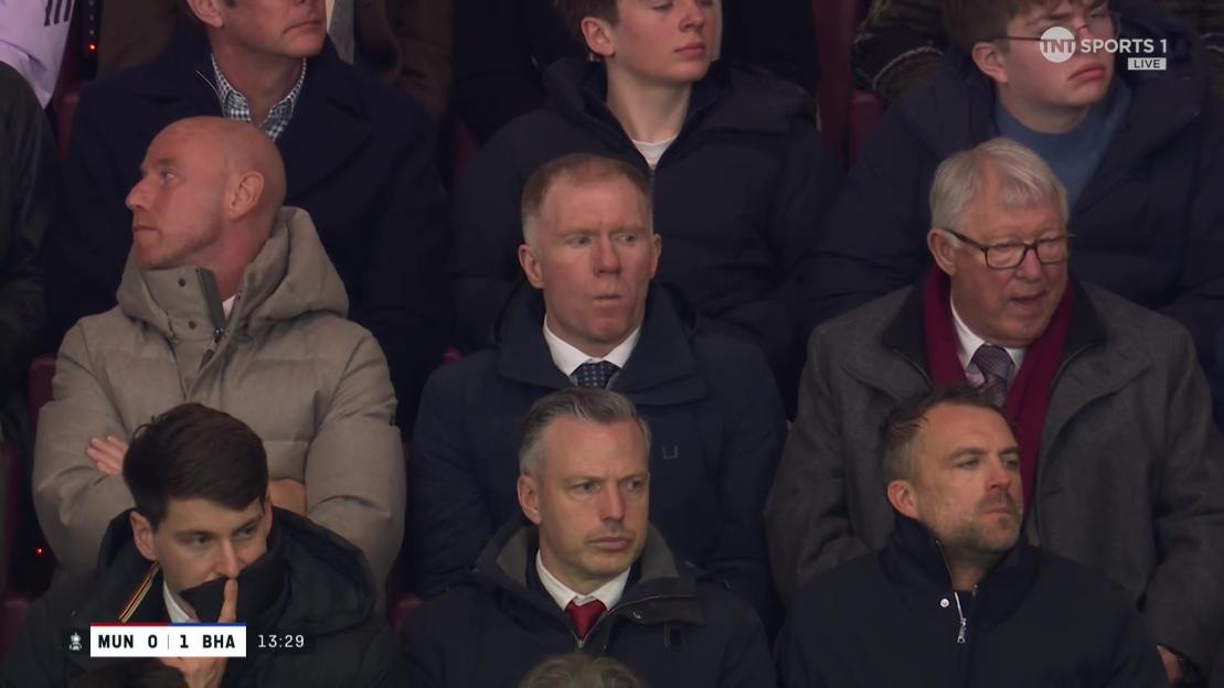 Paul Scholes and Alex Ferguson watching a football match.