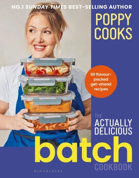 Cookbook cover for "Poppy Cooks: The Actually Delicious Batch Cookbook" by Poppy O'Toole, featuring O'Toole holding four stacked meal prep containers filled with food.