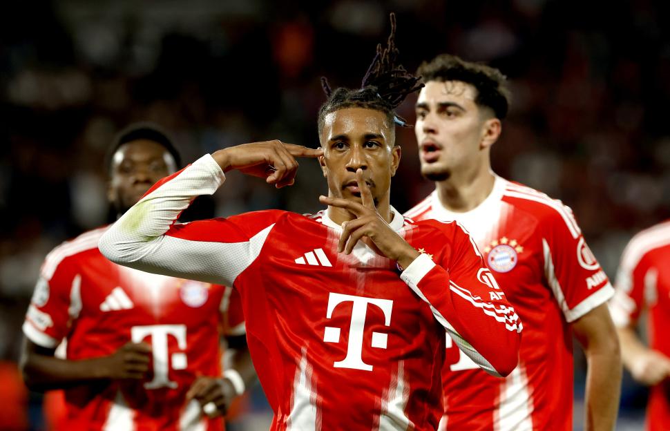 Michael Olise celebrates scoring his team's second goal.