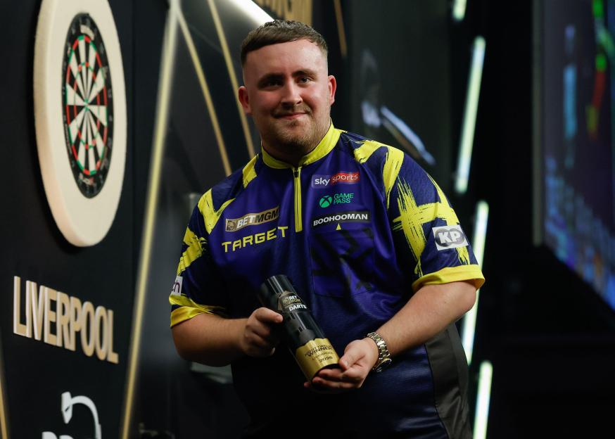 Liverpool, United Kingdom, 23rd April 2026. Luke Littler poses for a photo with the trophy following the Jonny Clayton v Luke Littler 2026 BetMGM Premier League match at M&S Bank Arena, Liverpool. Picture credit should read: Cody Froggatt / Sportimag