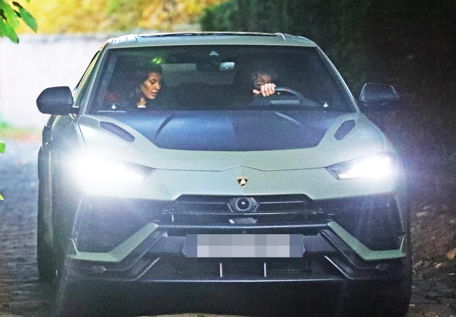 Ruben Dias and Maya Jama leaving a house in an army green Lamborghini Urus.