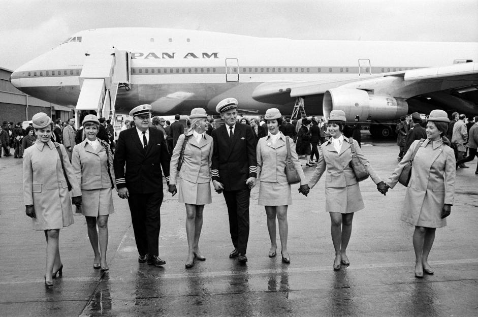 Pan Am Captains and flight attendants pose in front of a Boeing 747.
