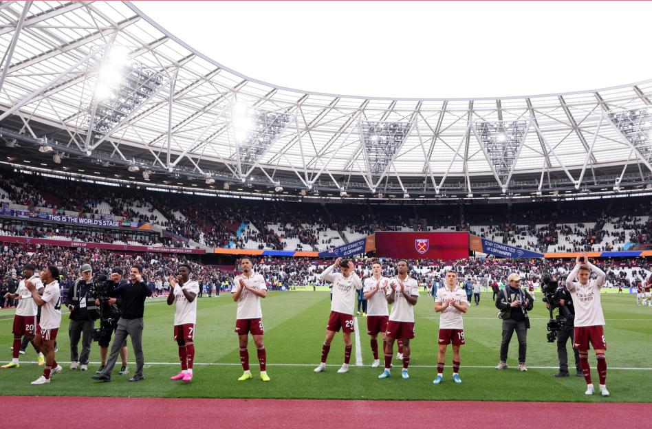 General view of the Arsenal team acknowledging fans after a Premier League match at London Stadium.
