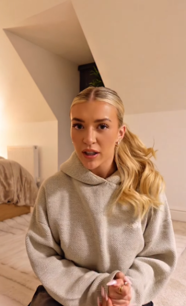Molly Marsh in a gray hoodie with her blonde hair tied back.