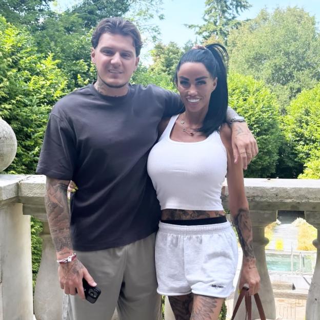 Katie Price and JJ Slater posing together outdoors.