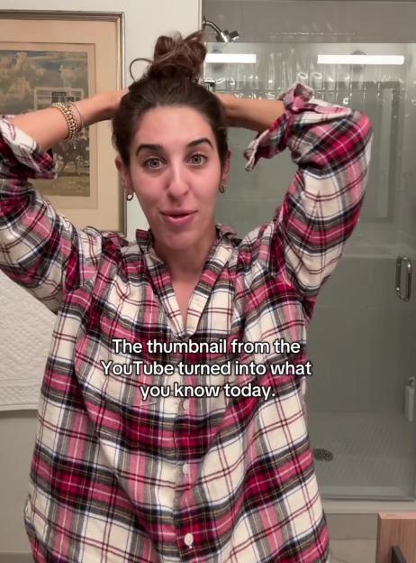 A woman in a red and white plaid shirt with her hair in a bun looks at the camera with text on the bottom.