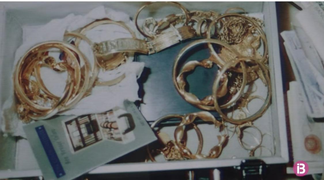 Gold bracelets and jewelry in a box.