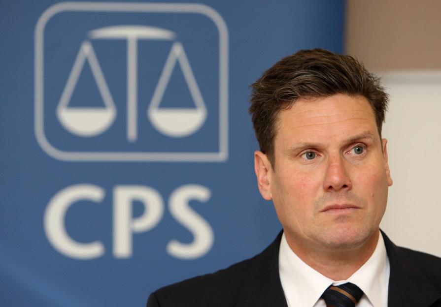 Keir Starmer QC, Director of Public Prosecutions at the Crown Prosecution Service, in front of the CPS logo.
