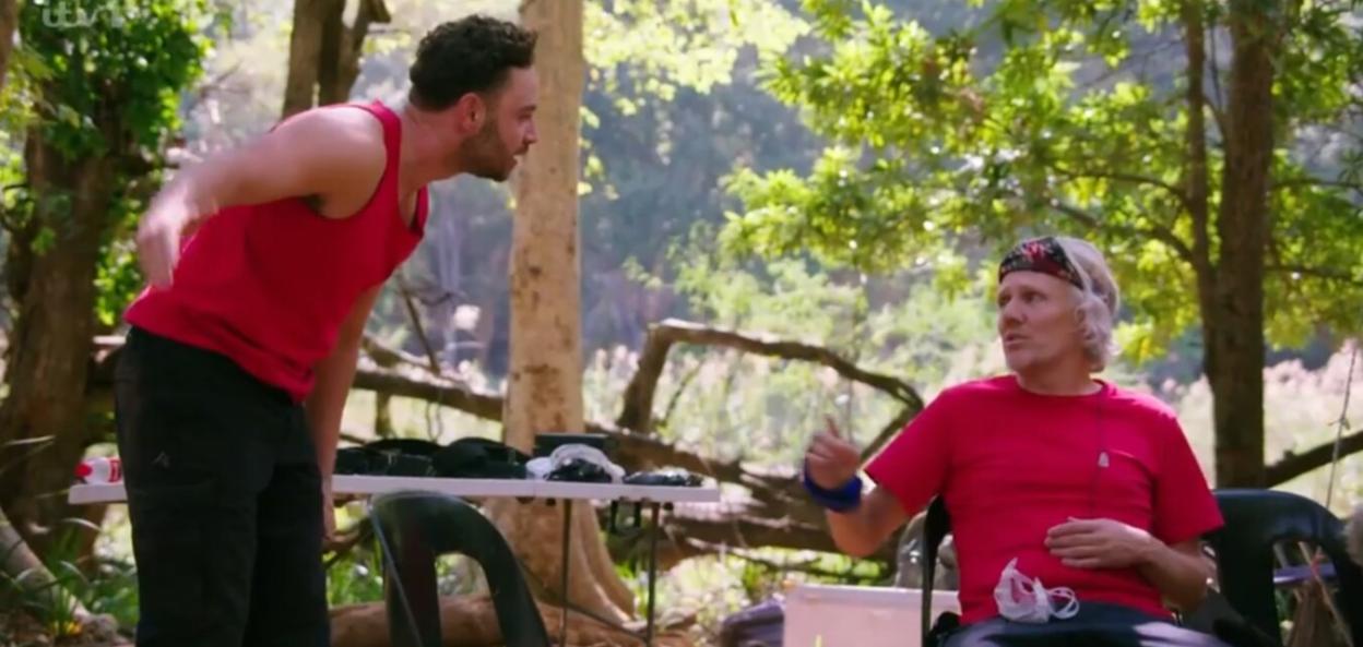 Adam Thomas and another man having a disagreement.