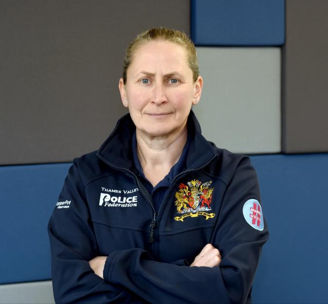 Aileen O'Connor, Thames Valley Police Federation Chair, standing with arms crossed, wearing a dark blue jacket.