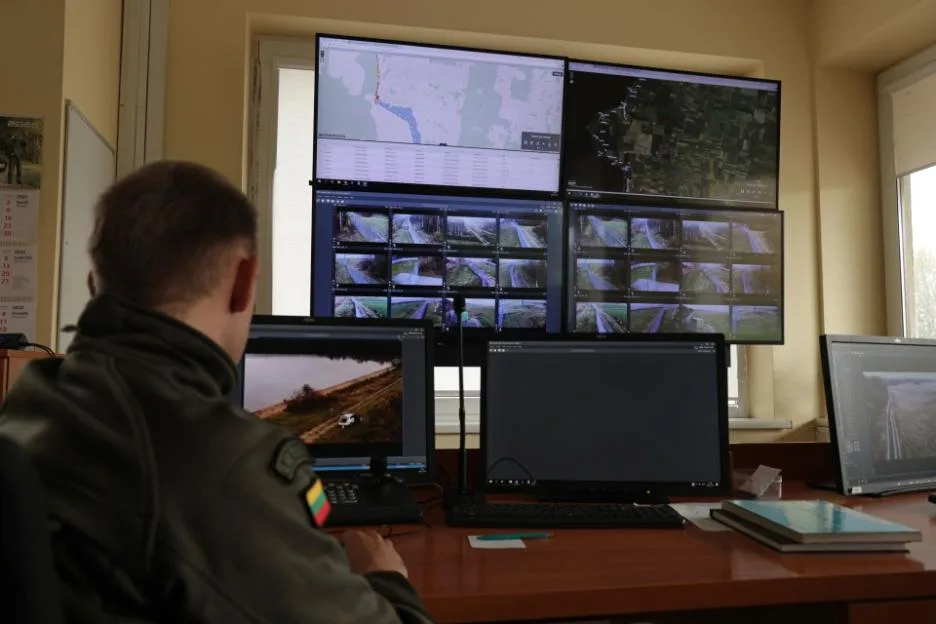 VISTYTIS, LITHUANIA - OCTOBER 28: A Lithuanian border guard monitors the video feed from cameras along the border to the Russian semi-exclave of Kaliningrad on October 28, 2022 in Vistytis, Lithuan...