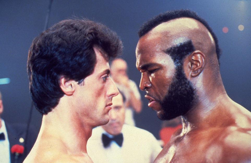 Sylvester Stallone and Mr. T stare each other down in a still from Rocky III.