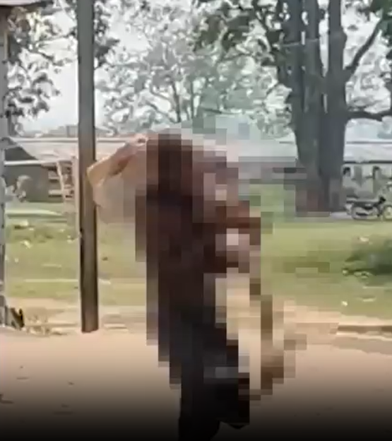 Man carrying his dead sister's skeleton to a local bank branch.