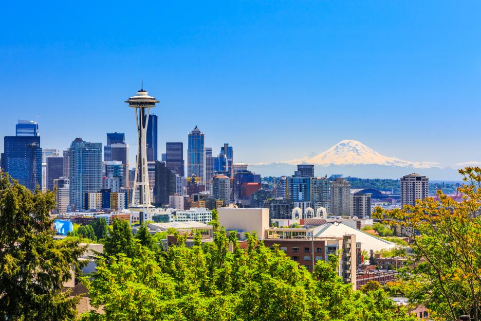 Seattle skyline with the Space Needle and Mt. Rainier in the background.