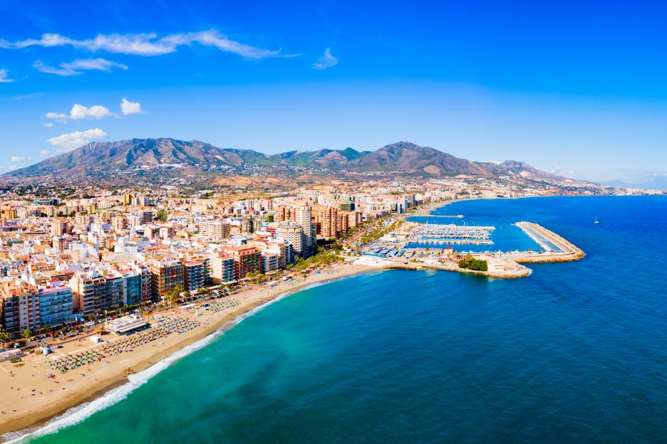 Aerial panoramic view of Fuengirola city beach and marina.