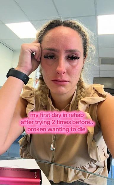 A woman with red eyes and tear-stained cheeks with text about being in rehab and wanting to die.