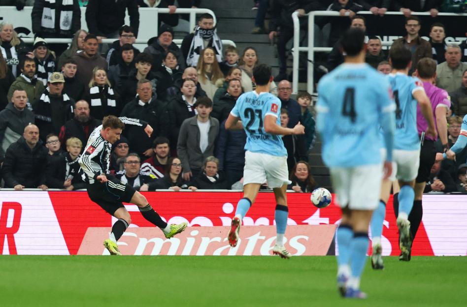 Harvey Barnes scoring Newcastle United's first goal against Manchester City.