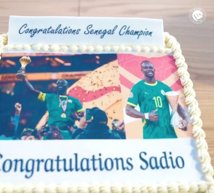 Celebratory cake with images of Sadio Mane and text "Congratulations Senegal Champion" and "Congratulations Sadio".