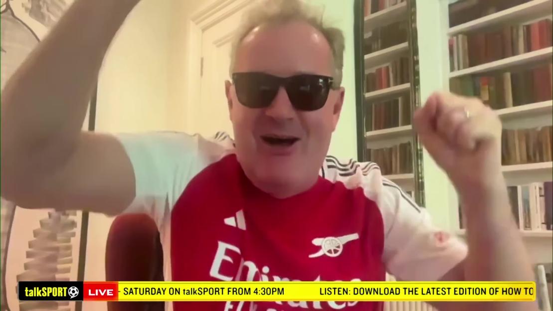 Piers Morgan wearing sunglasses and an Arsenal jersey, pumping his fists in excitement.