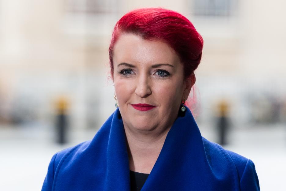 Secretary of State for Transport Louise Haigh, with bright red hair and a royal blue coat.