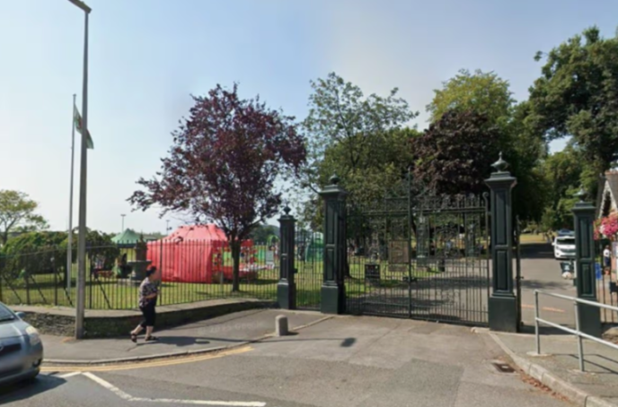 Entrance to Carmarthen Park with black iron gates.