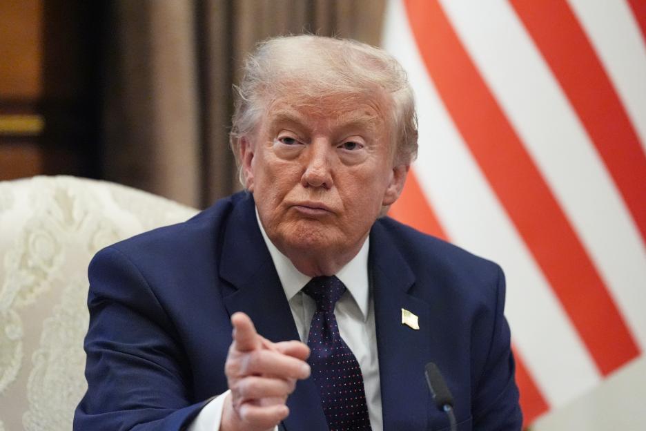 President Donald Trump points during a bilateral meeting.